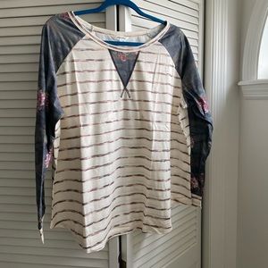 Brand new long sleeve with camouflage floral print sleeve.